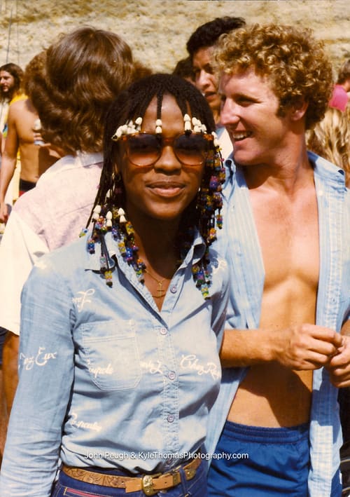 A bearded man in glasses in the crowd