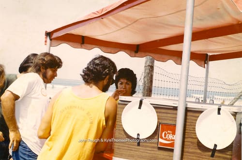 Under the red awning