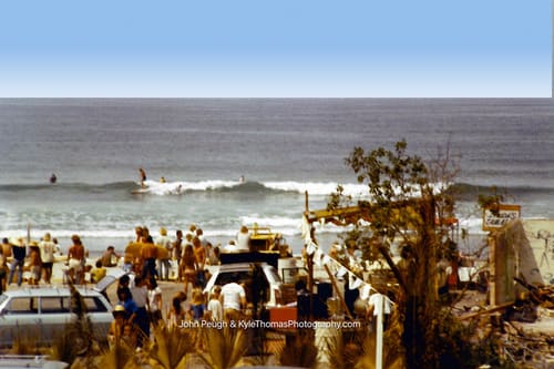 From the bluff — a rider, and the whole beach