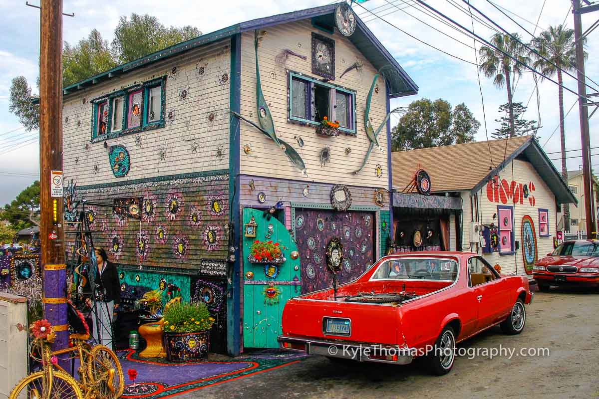 The Rock 'n' Roll House in Encinitas — a mosaic-covered two-story house with a red El Camino parked out front