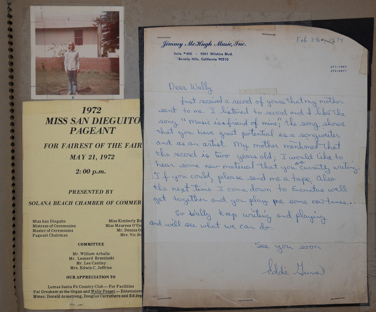 A 1974 handwritten letter on Jimmy McHugh Music letterhead mounted in a scrapbook beside a 1972 Miss San Dieguito Pageant programme and a snapshot of a boy